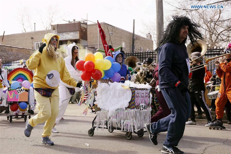 People participate in the Chicago Urban Shopping Cart Race in Chicago, the United States, on March 4, 2017. 