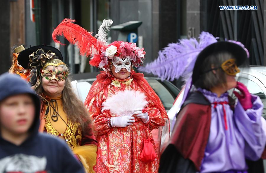 People take part in the mask carnival in Brussels, Belgium, March 4, 2017.