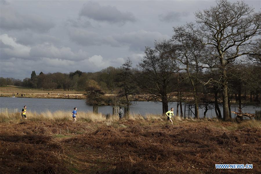 Competitors from a running club participate in a running race in southwest London's Richmond Park, Britain on March 4, 2017.