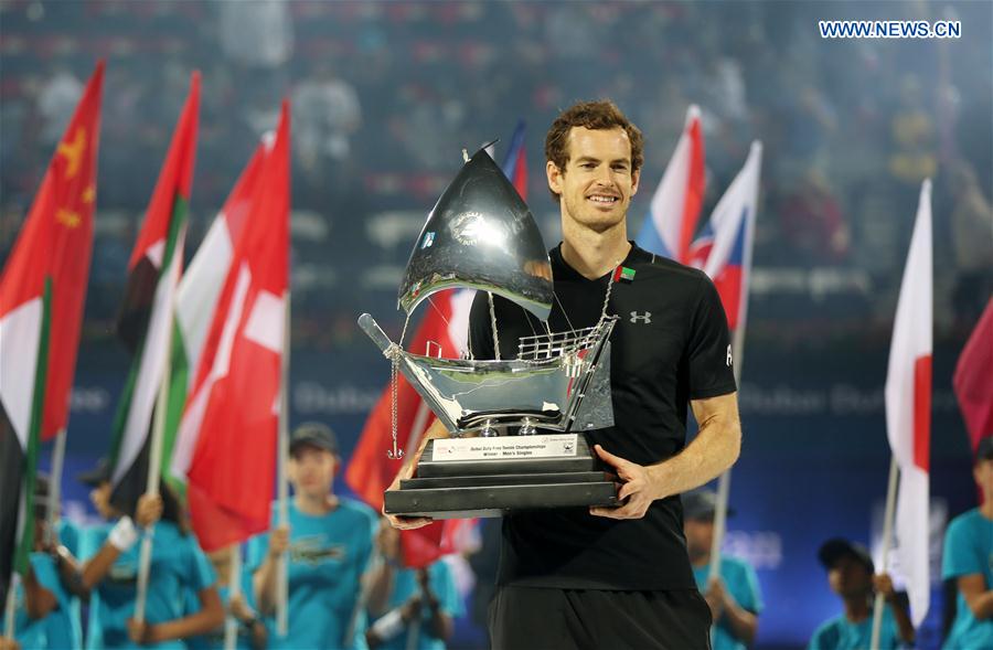 Andy Murray of Britain poses with the trophy after winning the men's singles final match against Fernando Verdasco of Spain at the Dubai Duty Free Tennis ATP Championships in Dubai, the United Arab Emirates, March 4, 2017. 