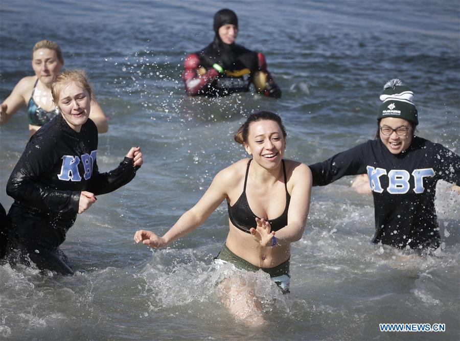 People participate in Polar Plunge to raise money for Special Olympics at Kitsilano Beach in Vancouver, Canada, March 4, 2017. 