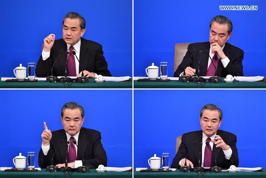 This combined photo shows Chinese Foreign Minister Wang Yi taking questions on China's foreign policy and foreign relations at a press conference for the fifth session of the 12th National People's Congress in Beijing, capital of China, March 8, 2017.