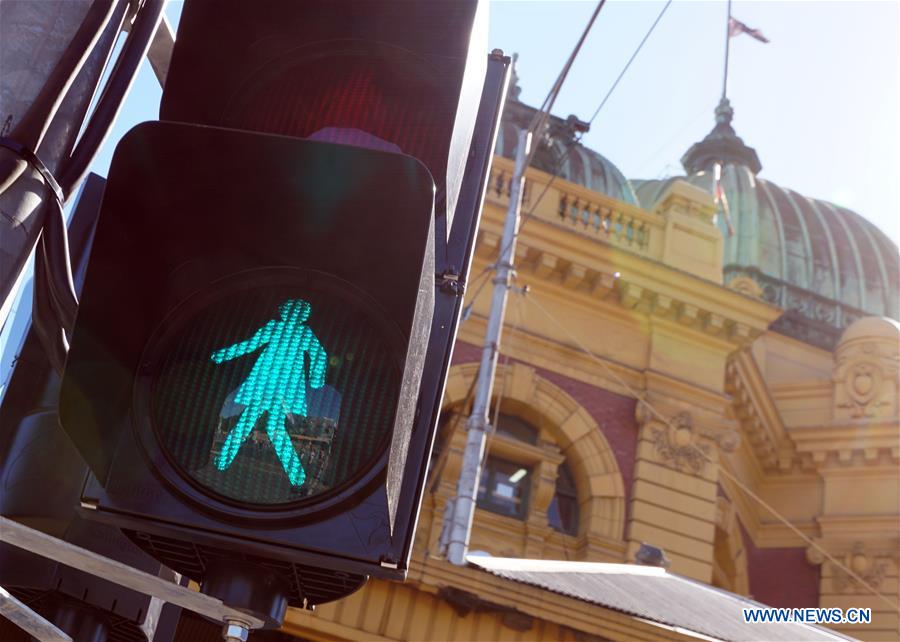 AUSTRALIA-MELBOURNE-TRAFFIC LIGHTS-FEMALE FIGURE