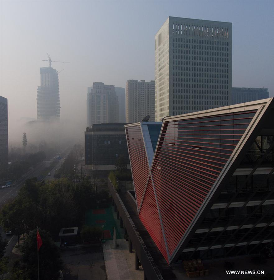 Photo taken on March 8, 2017 shows fog-shrouded buildings in Chengdu, capital of southwest China's Sichuan Province. (Xinhua/Jiang Hongjing)