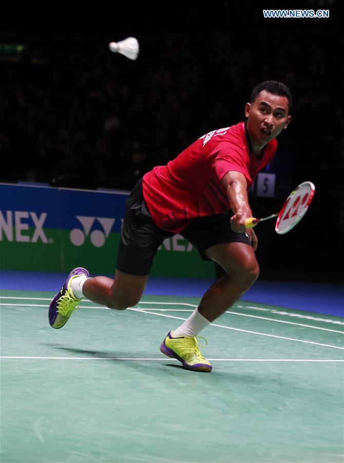 Tommy Sugiarto of Indonesia returns the shuttlecock during the men's singles first round match with China's Tian Houwei at All England Open Badminton 2017 in Birmingham, Britain on March 8, 2017. 