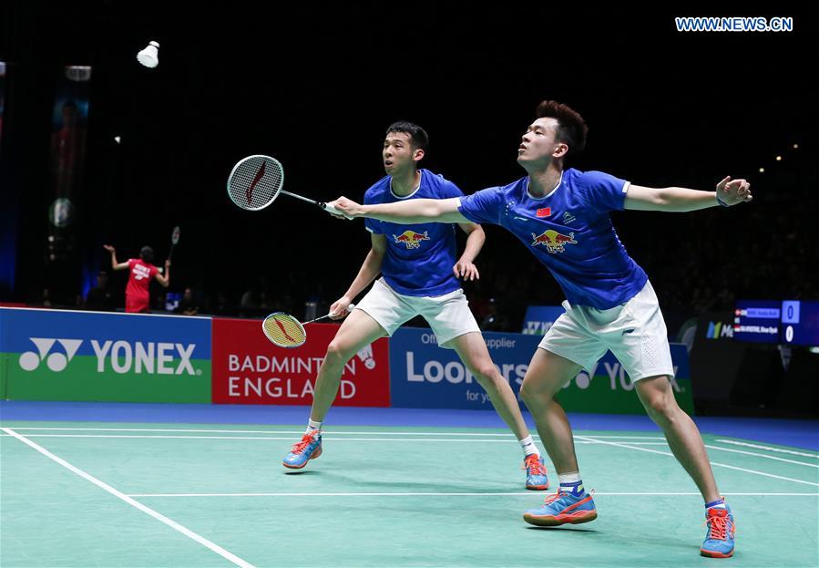 China's Lu Kai/Zheng Siwei (R) compete during the men's doubles first round match with Mathias Boe/Carsten Mogensen of Denmark at All England Open Badminton 2017 in Birmingham, Britain on March 8, 2017. 