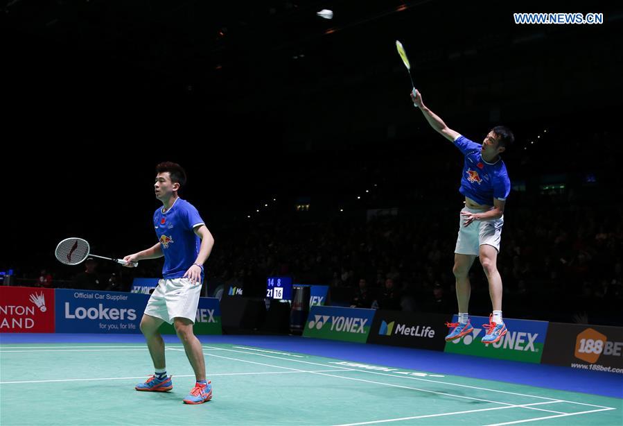 China's Lu Kai/Zheng Siwei (L) compete during the men's doubles first round match with Mathias Boe/Carsten Mogensen of Denmark at All England Open Badminton 2017 in Birmingham, Britain on March 8, 2017. 