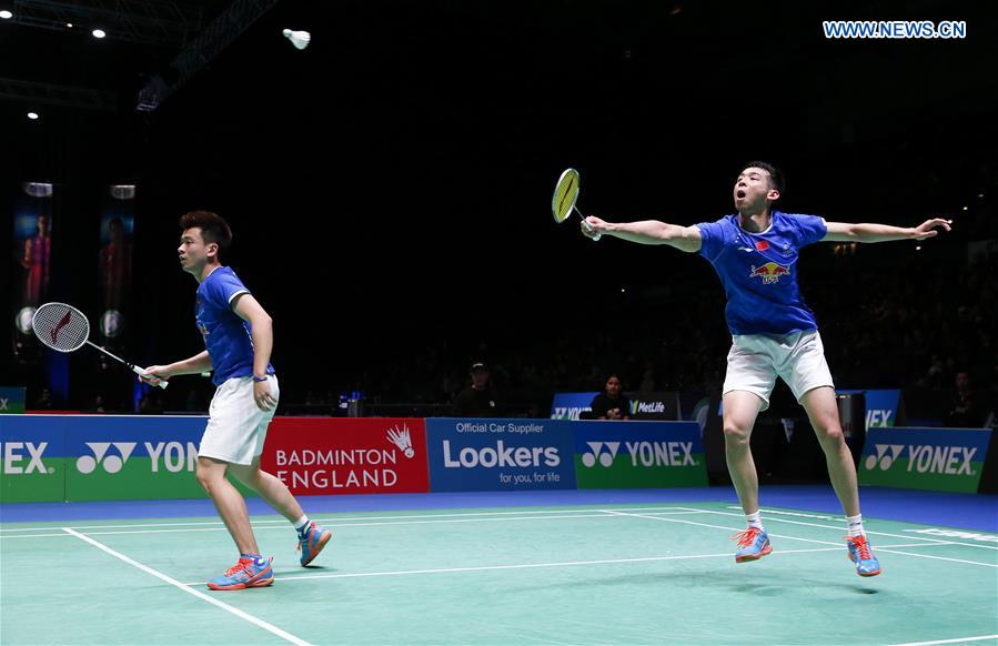 China's Lu Kai/Zheng Siwei (L) compete during the men's doubles first round match with Mathias Boe/Carsten Mogensen of Denmark at All England Open Badminton 2017 in Birmingham, Britain on March 8, 2017. 