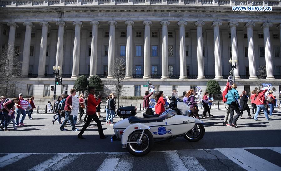 Hundreds of people attend a protest and march against U.S. President Donald Trump's global gag rule in Washington D.C., the United States, on March 8, 2017. 