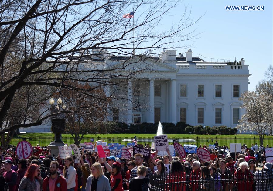 Hundreds of people attend a protest and march against U.S. President Donald Trump's global gag rule in Washington D.C., the United States, on March 8, 2017. 