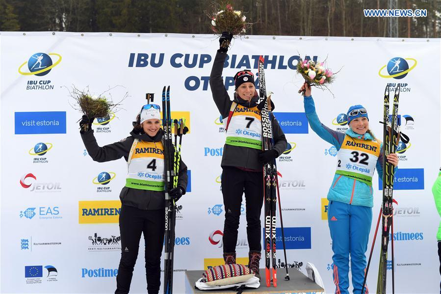 First place winner Enora Latuilliere (C) of France pose with her teammate, second place winner Julia Simon (L) and third place winner Anna Nikulina of Russia during the awarding ceremony of the Women's 7.5km sprint race at the IBU Cup 2016/2017 in Otepaa, Estonia, March 11, 2017.