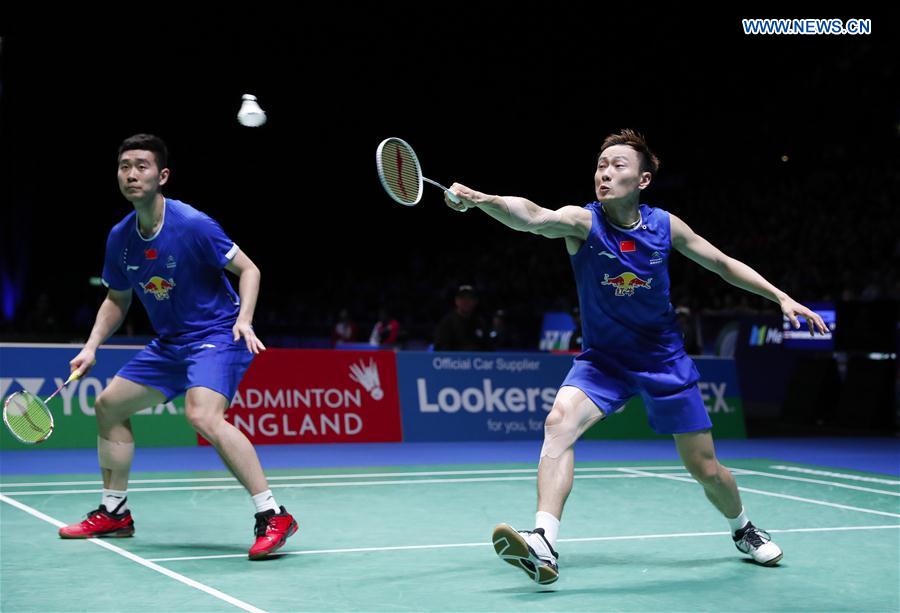 Liu Cheng/Zhang Nan (R) of China compete during the men's doubles semifinal against their teammates Li Junhui/Liu Yuchen at All England Open Badminton Championships 2017 in Birmingham, Britain on Mar. 11, 2017. 