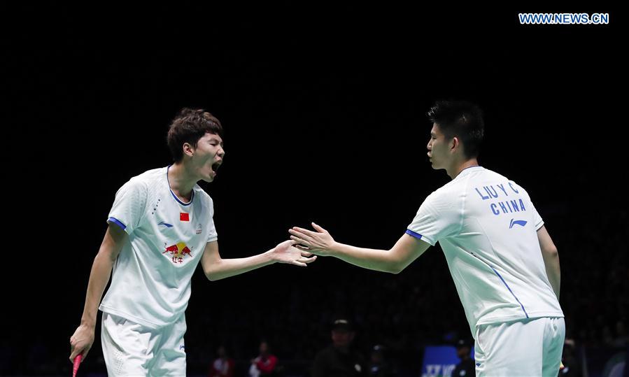 Li Junhui (L)/Liu Yuchen of China celebrate during the men's doubles semifinal against their teammates Liu Cheng/Zhang Nan at All England Open Badminton Championships 2017 in Birmingham, Britain on Mar. 11, 2017. 