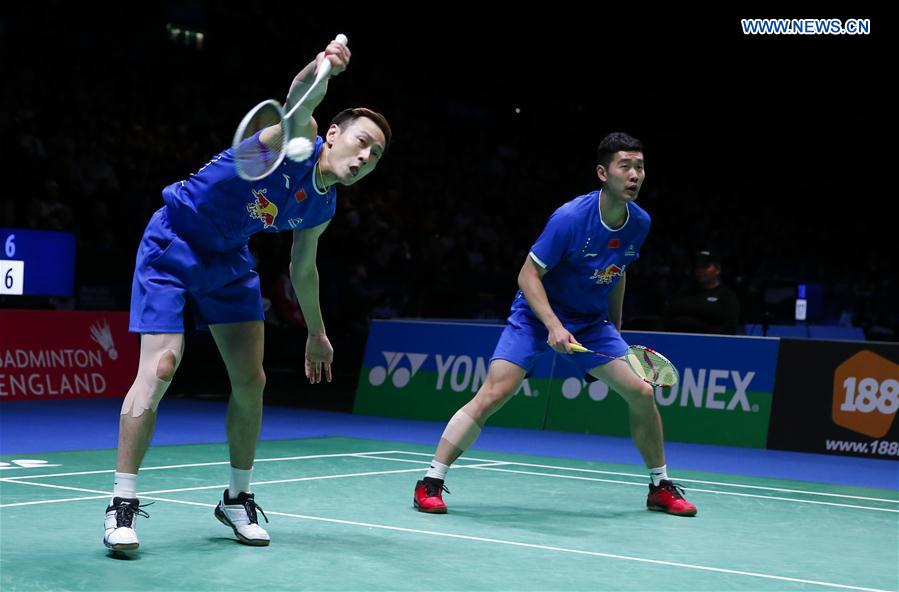 Liu Cheng/Zhang Nan (L) of China compete during the men's doubles semifinal against their teammates Li Junhui/Liu Yuchen at All England Open Badminton Championships 2017 in Birmingham, Britain on Mar. 11, 2017. 