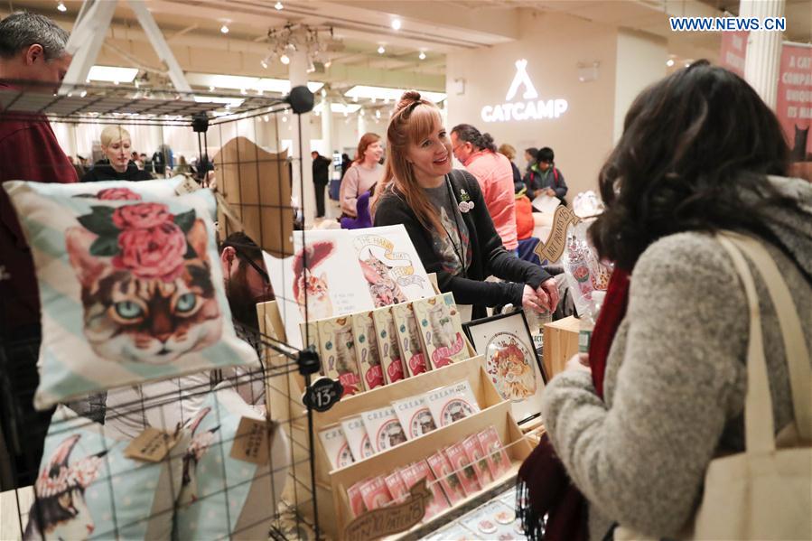 A vender introduces cat-focused products during the Cat Camp in New York, the United States, on March 11, 2017. A vender introduces cat-focused products during the Cat Camp in New York, the United States, on March 11, 2017.
