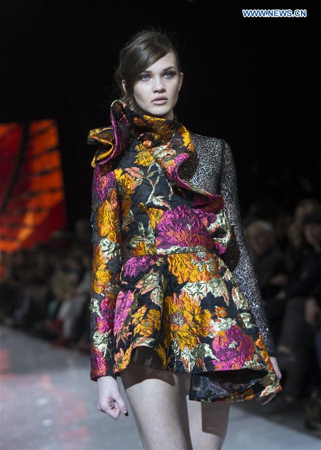 A model walks the runway wearing Stephan Caras 2017 collection during the Toronto Women's Fashion Week in Toronto, Canada, March 11, 2017.