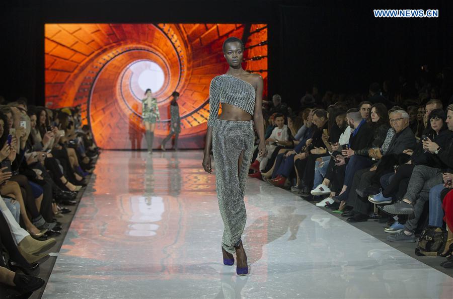 A model walks the runway wearing Stephan Caras 2017 collection during the Toronto Women's Fashion Week in Toronto, Canada, March 11, 2017. 