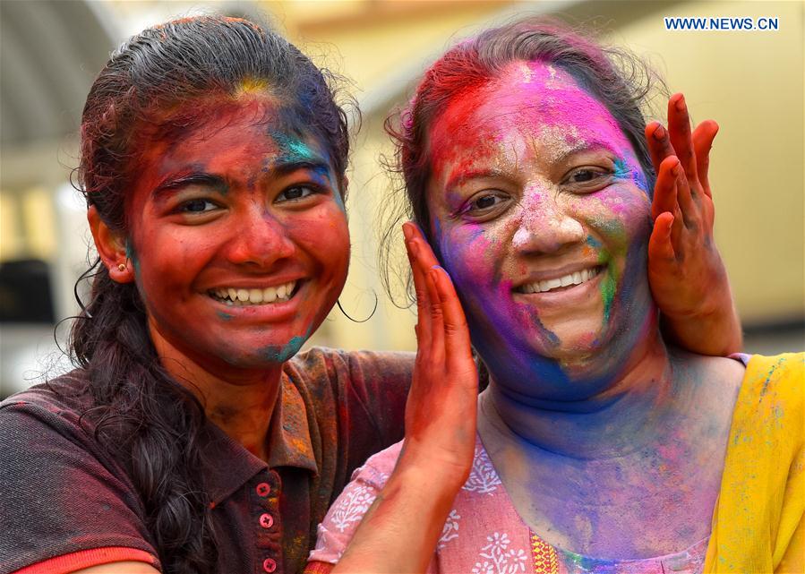Girls of Indian community in Qatar are covered in colored powder during celebrations of the Holi, the Indian festival of Colors, in Doha, capital of Qatar, on March 13, 2017. 