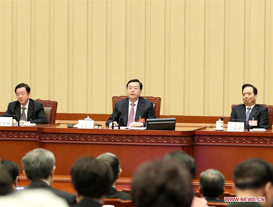 Zhang Dejiang, executive chairperson of the presidium for the fifth session of China's 12th National People's Congress (NPC) and chairman of the Standing Committee of the NPC, presides over the fourth meeting of the presidium for the fifth session of the 12th NPC at the Great Hall of the People in Beijing, capital of China, March 14, 2017.