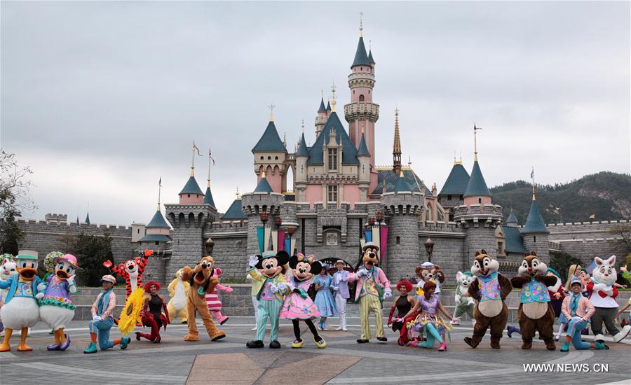 Classic Disney characters walk out of Hong Kong Disneyland before a Springtime Carnival which will kick off Thursday in Hong Kong, south China, March 15, 2017. 
