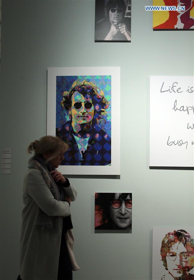 A woman visits the exhibition 'Imagine John Lennon' at the Kurpfaelzische Museum in Heidelberg, Germany, on March 15, 2017. 