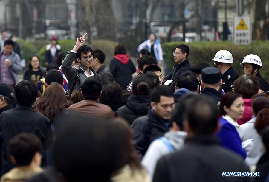 Students walk out of the exam site at the Tianjin No. 1 Middle School in Tianjin, north China, March 17, 2017. Students took part in the first test for English as part of China's National College Entrance Examination in Tianjin on Friday. As from 2017, two oral and written tests will be held for English during the National College Entrance Examination in Tianjin, and the better scores will be chosen as the final results. (Xinhua/Yue Yuewei) 