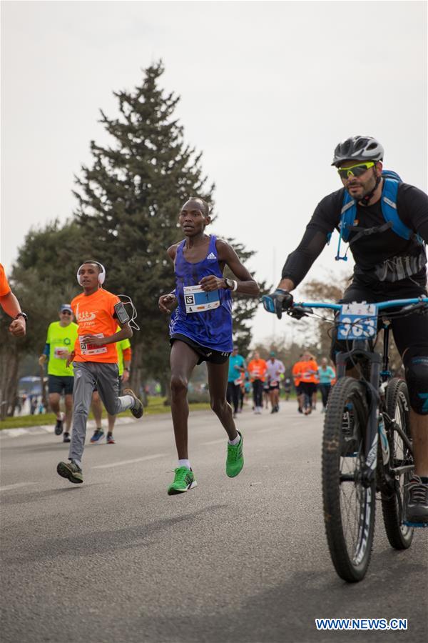 Runners take part in the 7th International Jerusalem Winner Marathon in Jerusalem, on March 17, 2017. (Xinhua/Guo Yu)