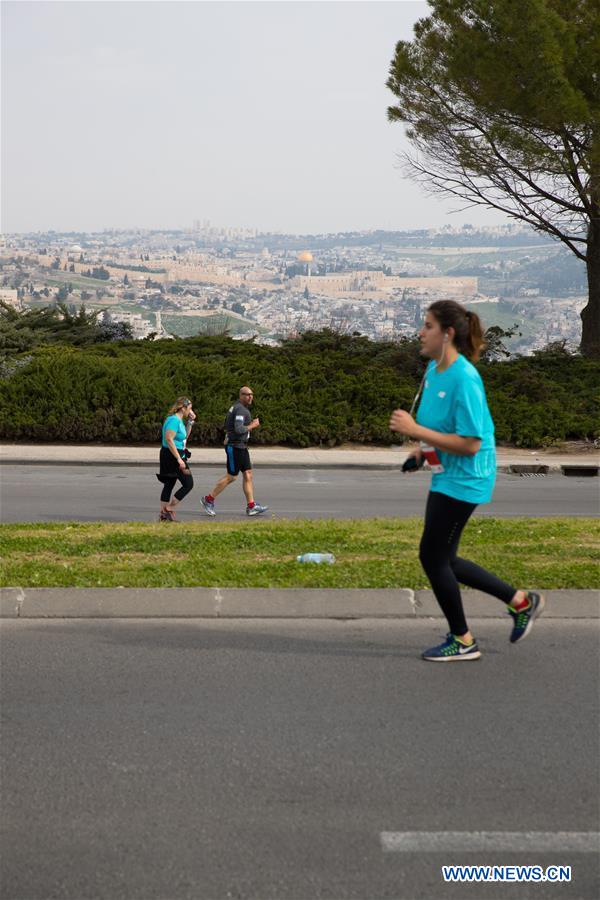 Runners take part in the 7th International Jerusalem Winner Marathon in Jerusalem, on March 17, 2017. (Xinhua/Guo Yu)