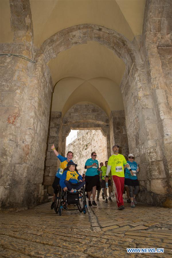 Runners take part in the 7th International Jerusalem Winner Marathon in Jerusalem, on March 17, 2017. (Xinhua/Guo Yu)