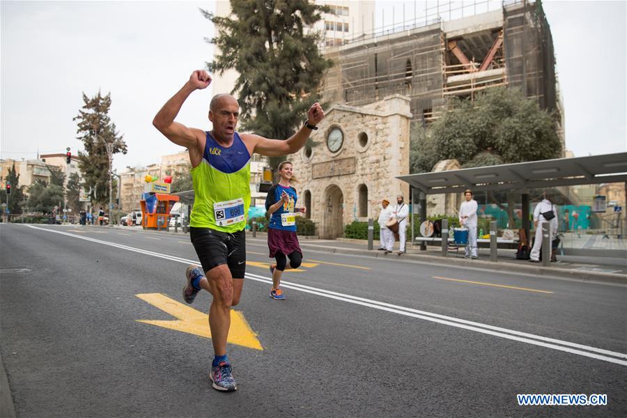 Runners take part in the 7th International Jerusalem Winner Marathon in Jerusalem, on March 17, 2017. (Xinhua/Guo Yu)