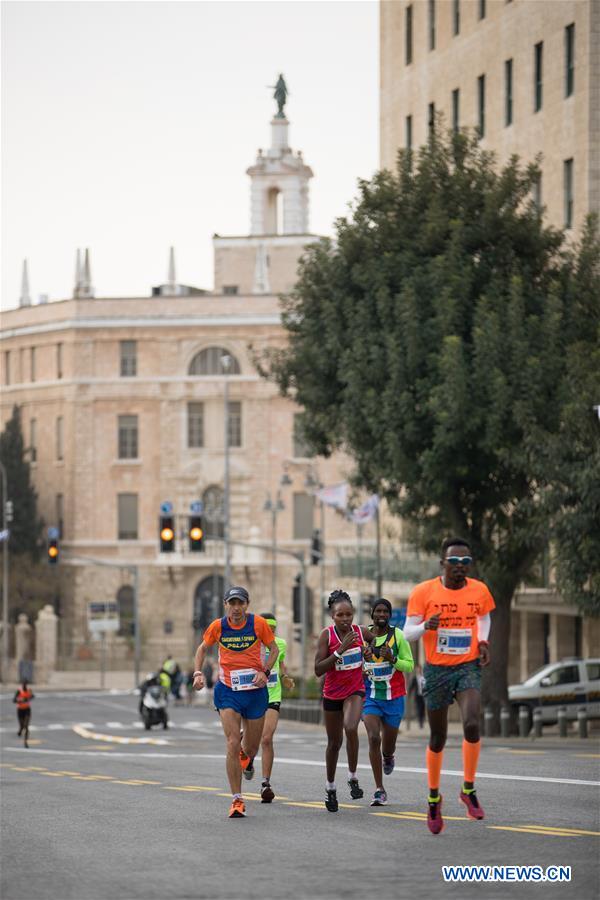 Runners take part in the 7th International Jerusalem Winner Marathon in Jerusalem, on March 17, 2017. (Xinhua/Guo Yu)