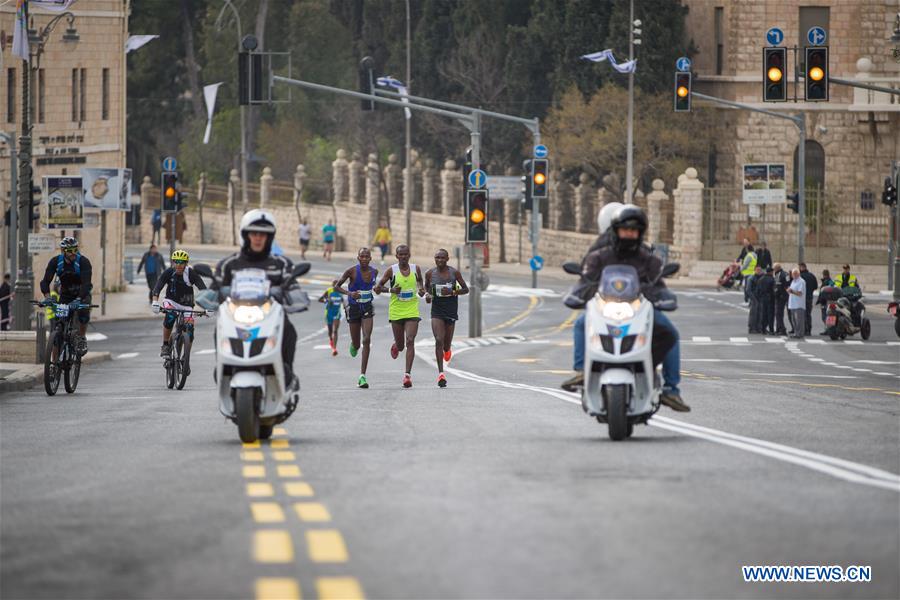 Runners take part in the 7th International Jerusalem Winner Marathon in Jerusalem, on March 17, 2017. (Xinhua/Guo Yu)
