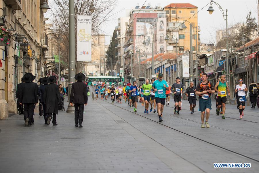 Runners take part in the 7th International Jerusalem Winner Marathon in Jerusalem, on March 17, 2017. (Xinhua/Guo Yu)
