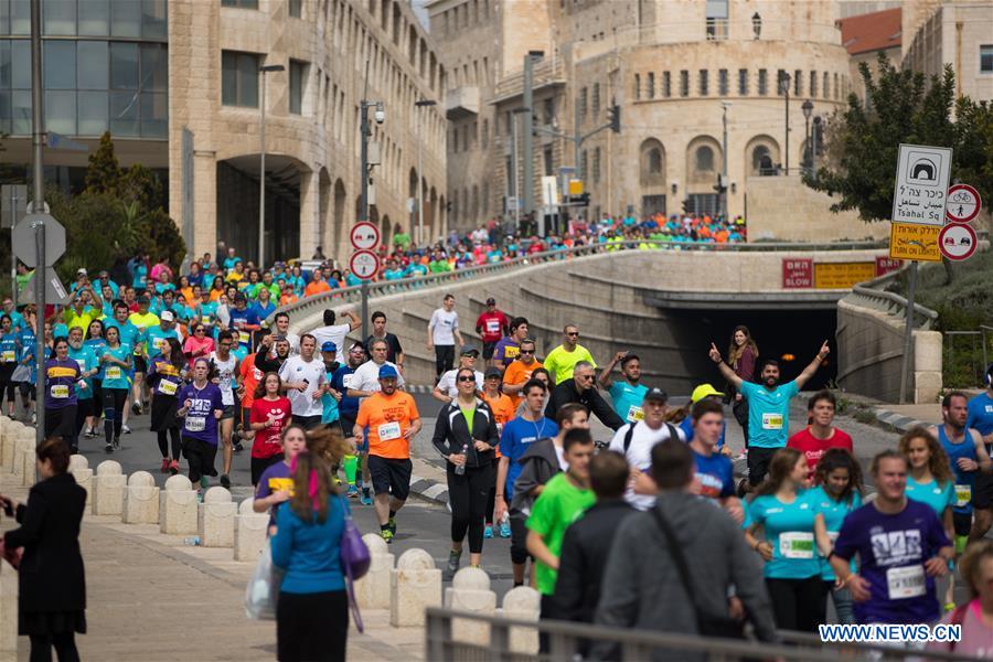 Runners take part in the 7th International Jerusalem Winner Marathon in Jerusalem, on March 17, 2017. (Xinhua/Guo Yu)