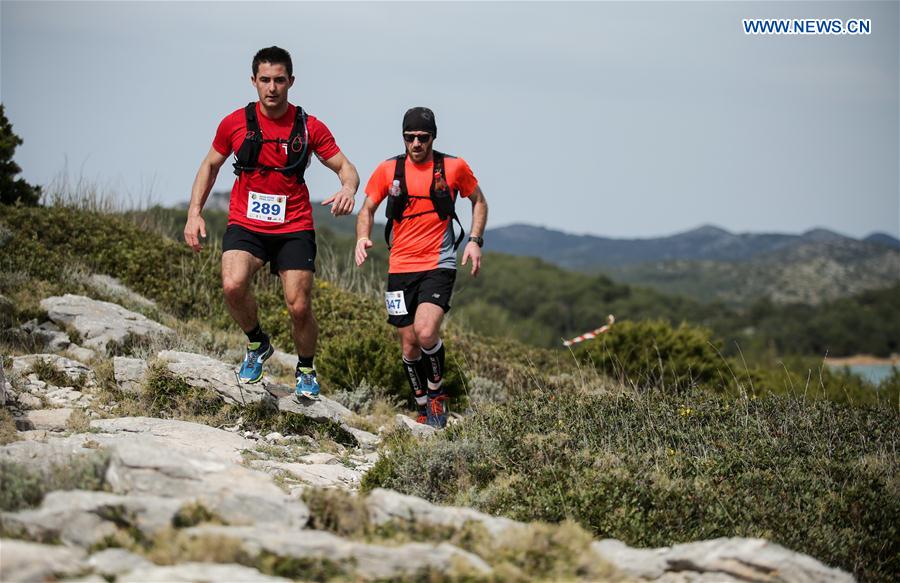 Klaudio Kotlar (L) and Sinisa Miocic compete during Blue Cliff 23km/720m+ trail race in Dugi Otok, south Croatia, March 18, 2017. The route passes through the nature park of the Telascica in the Zadar archipelago. 