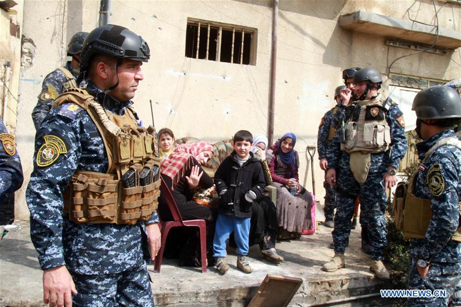 Iraqi federal police forces patrol the street in Alkulat area, western Mosul, Iraq, on March 20, 2017. As Iraqi forces gained more territories in western Mosul, the federal police strengthened their control on the newly-liberated areas and began clearing the improvised explosive devices left by Islamic State group. (Xinhua/Yaser Jawad) Iraqi federal police forces patrol the street in Alkulat area, western Mosul, Iraq, on March 20, 2017. As Iraqi forces gained more territories in western Mosul, the federal police strengthened their control on the newly-liberated areas and began clearing the improvised explosive devices left by Islamic State group. (Xinhua/Yaser Jawad)
