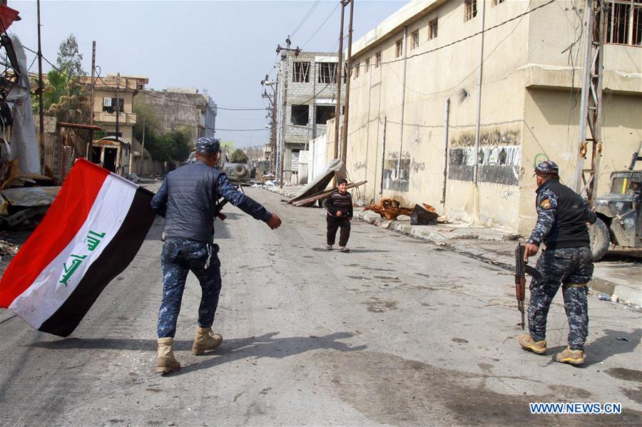 Iraqi federal police forces patrol the street in Alkulat area, western Mosul, Iraq, on March 20, 2017. As Iraqi forces gained more territories in western Mosul, the federal police strengthened their control on the newly-liberated areas and began clearing the improvised explosive devices left by Islamic State group. (Xinhua/Yaser Jawad) Iraqi federal police forces patrol the street in Alkulat area, western Mosul, Iraq, on March 20, 2017. As Iraqi forces gained more territories in western Mosul, the federal police strengthened their control on the newly-liberated areas and began clearing the improvised explosive devices left by Islamic State group. (Xinhua/Yaser Jawad)