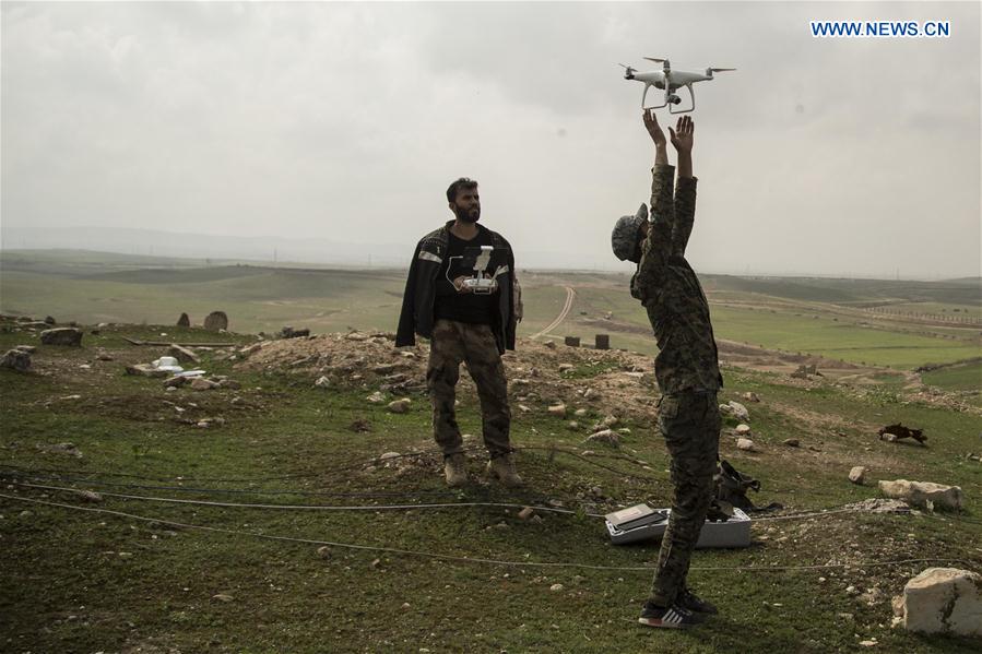Soldiers use drones to check on Islamic State positions during the joint operation to free Badush district, near Mosul, Iraq, on March 20, 2017. 