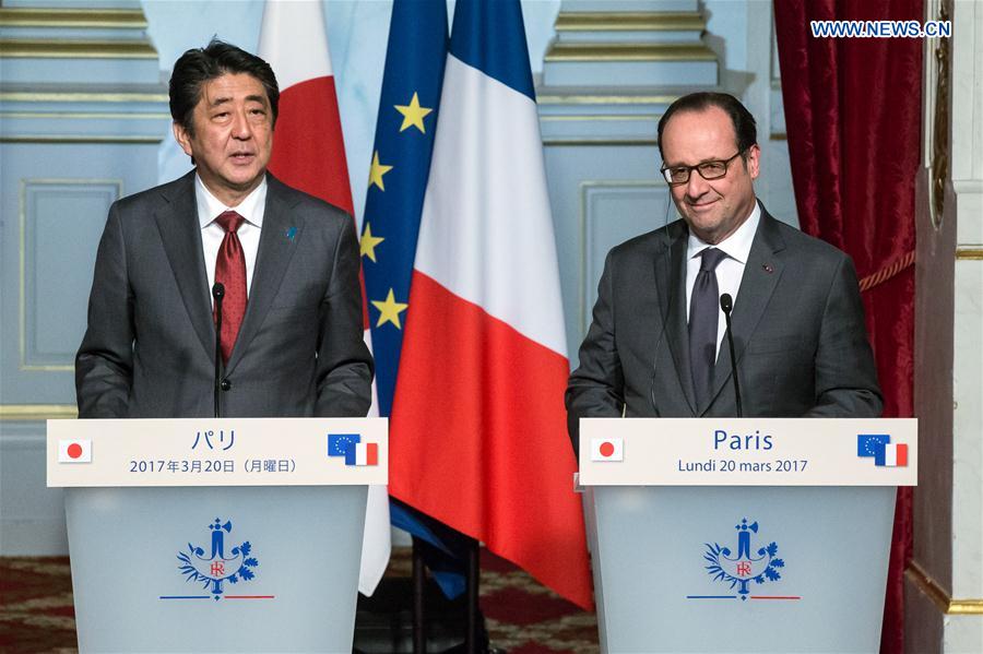 French President Francois Hollande (R) and visiting Japanese Prime Minister Shinzo Abe attend a joint press conference at the Elysee Palace in Paris, France, on March 20, 2017. French President Francois Hollande (R) and visiting Japanese Prime Minister Shinzo Abe attend a joint press conference at the Elysee Palace in Paris, France, on March 20, 2017.