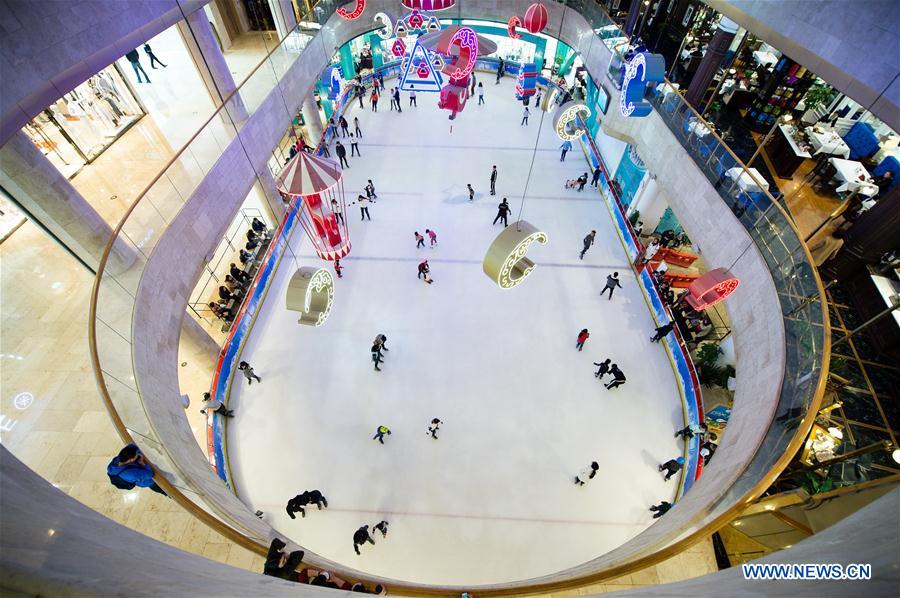 Citizens skate in an ice rink located in a shopping mall in Nanjing, capital of east China's Jiangsu province, March 4, 2017. With more and more people from south and west China participating in winter sports, the popularity of winter sports in east China's Jiangsu province began to grow fast. In recent years, 13 ice rinks using social capital have been opened in Jiangsu. The operators of these ice rinks established clubs to attract more than 100,000 people to practice skating. The Century Star Rink located in Nanjing Olympic Center is the biggest indoor ice rink in Nanjing. The club only had dozens of members in 2008, but now it has more than 20,000 members. At the mean time, the club cooperates with 8 elementary schools in neighborhood to open classes teaching skating skills. About 10,000 pupils learned the basic skills of skating and 4 ice hockey squads were founded in last 9 years. A total of 15 small outdoor ski resorts have also been set up in northern Jiangsu province. During the last snow season, which is only two months due to warm weather here, these ski resorts accommodated around 10,000 person-times of visitors. (Xinhua/Li Xiang)