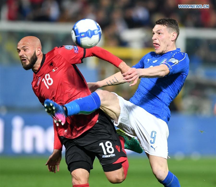 Arlind Ajeti of Albania(L) competes for the ball with Andrea Belotti of Italy during the FIFA 2018 World Cup Qualifying soccer match between Italy and Albania in Palermo, Italy, on March 24, 2017.
