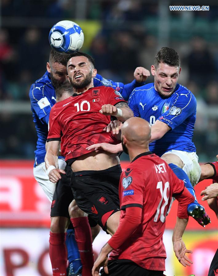 Armando Sadiku of Albania(L) competes for the ball with Andrea Belotti of Italy during the FIFA 2018 World Cup Qualifying soccer match between Italy and Albania in Palermo, Italy, on March 24, 2017.