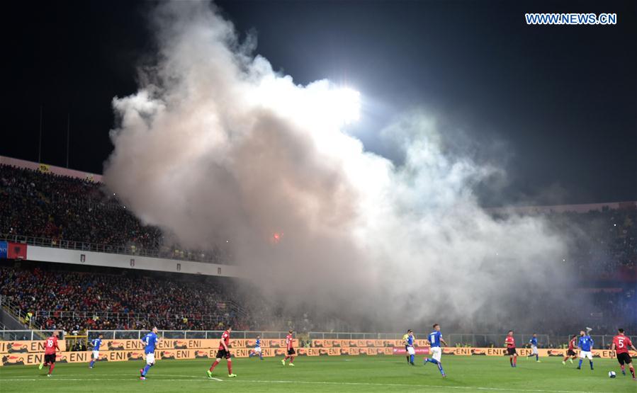 Albania's supporters throw smoke bombs and flares during the FIFA 2018 World Cup Qualifying soccer match between Italy and Albania in Palermo, Italy, on March 24, 2017.