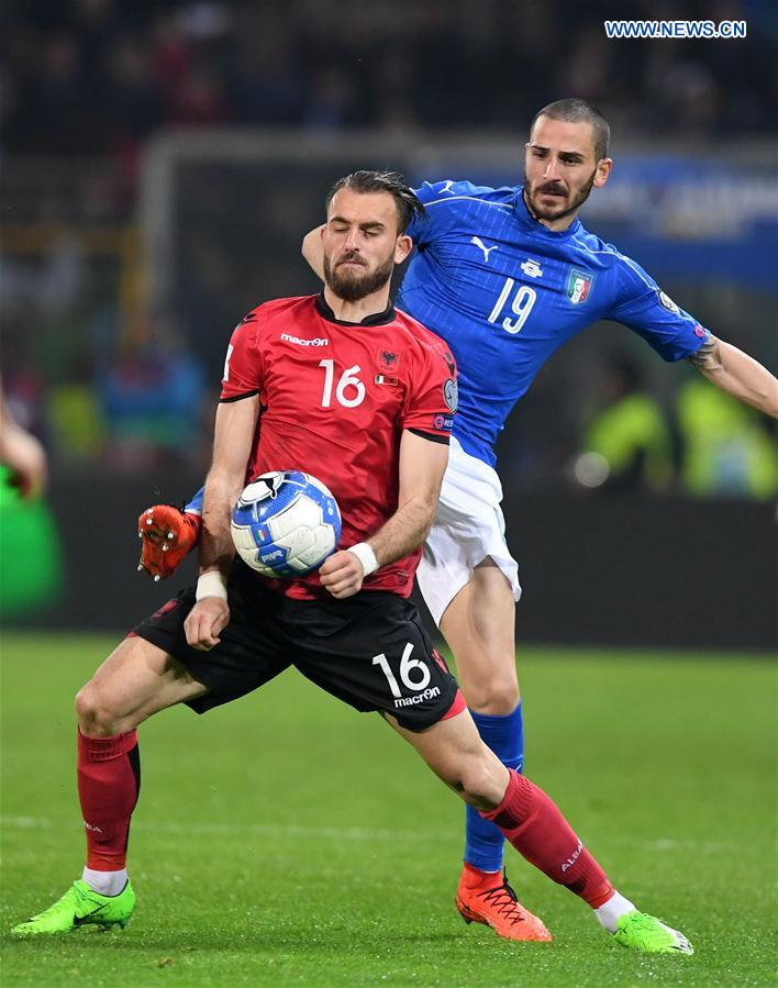 Sokol Cikalleshi of Albania(L) competes for the ball with Leonardo Bonucci of Italy during the FIFA 2018 World Cup Qualifying soccer match between Italy and Albania in Palermo, Italy, on March 24, 2017.