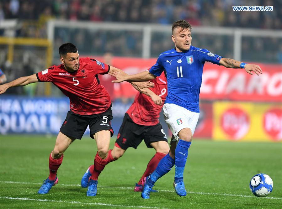 Frederic Veseli of Albania(L) competes for the ball with Ciro Immobile of Italy during the FIFA 2018 World Cup Qualifying soccer match between Italy and Albania in Palermo, Italy, on March 24, 2017.