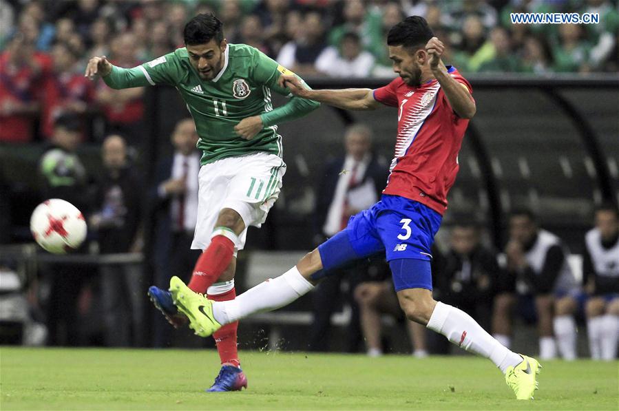 Mexico's Carlos Vela (L) vies with Costa Rica's Giancarlo Gonzalez during the qualifying match for 2018 Russia World Cup against Costa Rica in Mexico City, capital of Mexico, March 24, 2017. 