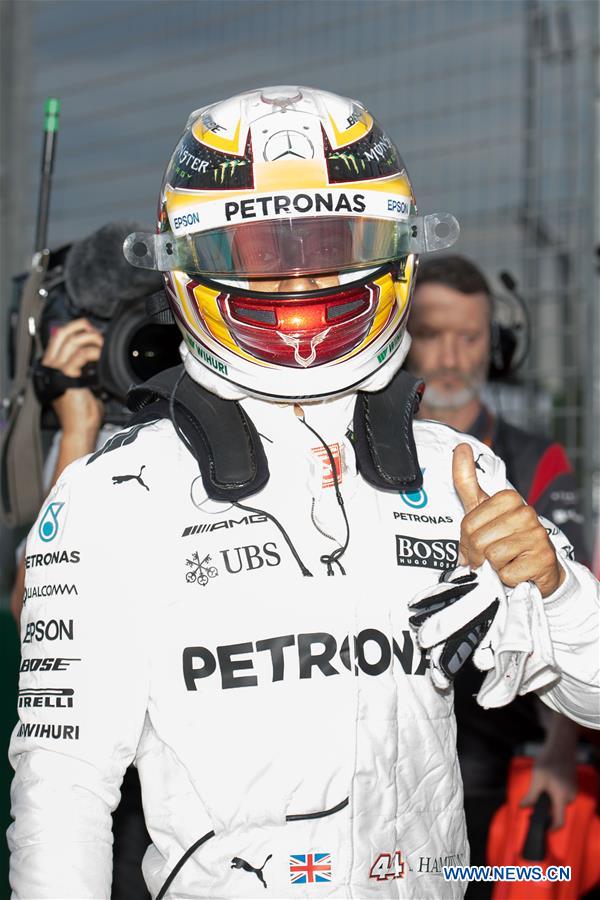 Mercedes AMG Petronas Formula One driver Lewis Hamilton of Britain celebrates after winning the qualifying session of the Australian Formula One Grand Prix at Albert Park circuit in Melbourne, Australia on March 25, 2017. Lewis Hamilton will start from the pole position. The Australian Formula One Grand Prix will take place in Melbourne on March 26. (Xinhua/Bai Xue) Mercedes AMG Petronas Formula One driver Lewis Hamilton of Britain celebrates after winning the qualifying session of the Australian Formula One Grand Prix at Albert Park circuit in Melbourne, Australia on March 25, 2017. Lewis Hamilton will start from the pole position. The Australian Formula One Grand Prix will take place in Melbourne on March 26. (Xinhua/Bai Xue)