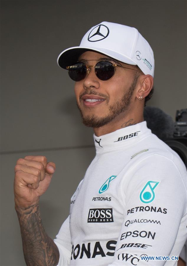 Mercedes AMG Petronas Formula One driver Lewis Hamilton of Britain celebrates after winning the qualifying session of the Australian Formula One Grand Prix at Albert Park circuit in Melbourne, Australia on March 25, 2017. Lewis Hamilton will start from the pole position. The Australian Formula One Grand Prix will take place in Melbourne on March 26. (Xinhua/Bai Xue) Mercedes AMG Petronas Formula One driver Lewis Hamilton of Britain celebrates after winning the qualifying session of the Australian Formula One Grand Prix at Albert Park circuit in Melbourne, Australia on March 25, 2017. Lewis Hamilton will start from the pole position. The Australian Formula One Grand Prix will take place in Melbourne on March 26. (Xinhua/Bai Xue)