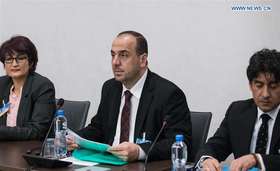 Syria's opposition delegation leader Nasr al-Hariri (C) attends a meeting of Intra-Syria peace talks with UN Special Envoy for Syria Staffan de Mistura at Palais des Nations in Geneva, Switzerland , March 25, 2017.