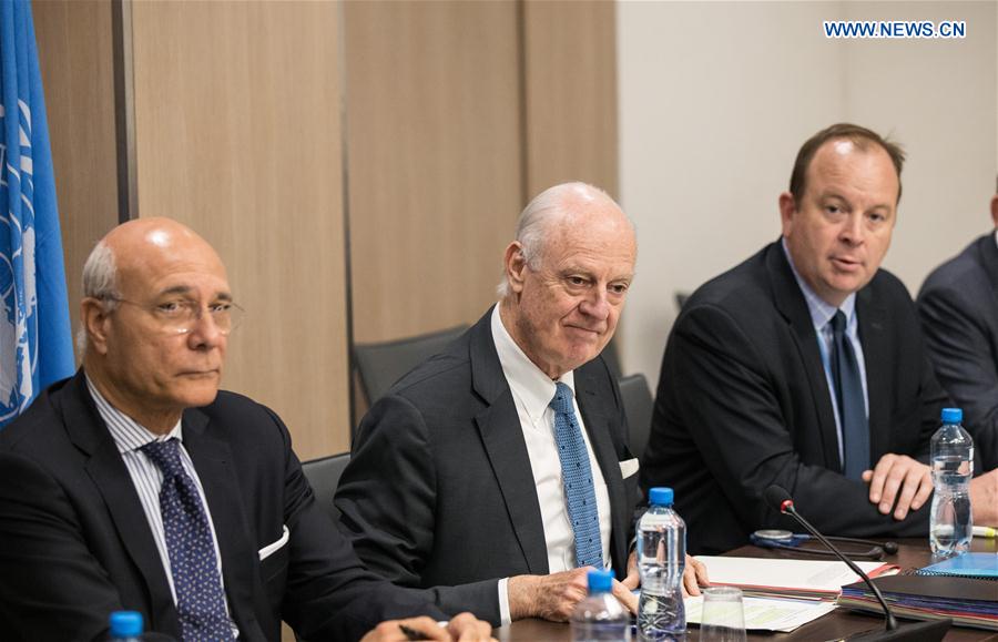 UN Special Envoy for Syria Staffan de Mistura (C) attends a meeting of Intra-Syria peace talks with Syria's opposition delegation at Palais des Nations in Geneva, Switzerland , March 25, 2017.